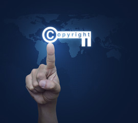 Hand pressing copyright key icon over digital world map technolo