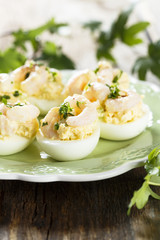 Stuffed eggs with shrimps and curry