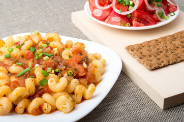 Cavatappi Pasta with sauce of stewed vegetables closeup