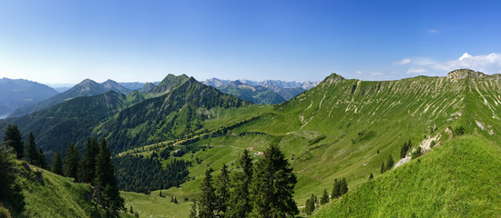 Fototapeta na wymiar Panoramic view of Kafell peak and other peaks during summer time in Tyrol, Austria. Panorama of view from Hochplatte mountain peak at 1,813 m. Kafell ranks as the 1106th highest mountain in Achenkirch