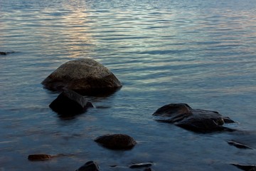 Beautiful tranquil summer sunset on the Onega lake, Karelia, Russia