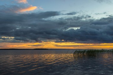 Beautiful tranquil summer sunset on the Onega lake, Karelia, Russia