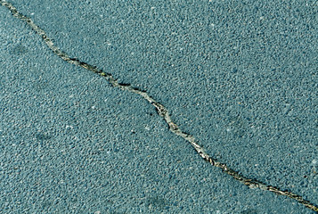 Obraz premium Cracked color asphalt surface.