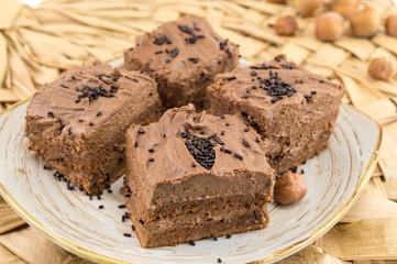 Hazelnut cake covered with chocolate cream