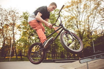 Naklejka premium Young man jumping on a BMX.