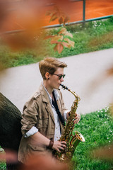 Young woman playing the saxophone