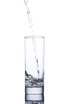 Drinking water is poured into a glass