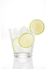 Full glass of water with lemon and mint isolated on white background