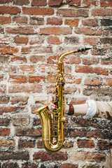 Close up of a girl holding saxophone