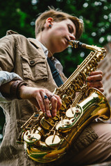Young woman playing the saxophone