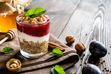 Buckwheat porridge with honey, yoghurt, walnuts and plum puree