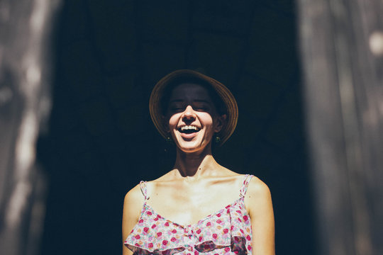 girl in a hat smiling 