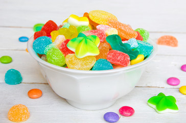 Many colorful candies of different form
