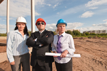 Director with subordinates on construction site
