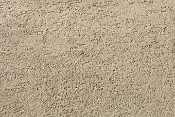 Beige painted stucco wall. Background texture