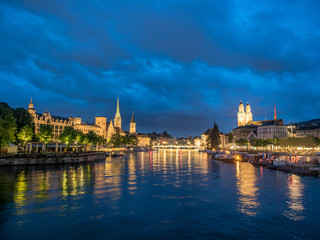 Fototapeta premium Night photo of Limmat river and Cityscape of old town Zurich, Switzerland