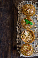 Healthy zucchini and oatmeal muffins on a rustic background, overhead view