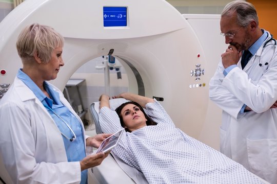 Two doctor talking to patient before mri scan test