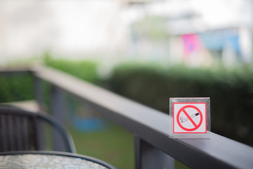 Selective focus No Smoking Sign On Table, focus no smoking sign.