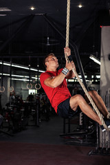 Fototapeta na wymiar Fitness rope climb cxercise