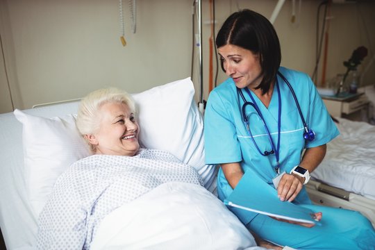Nurse interacting with patient in hospital
