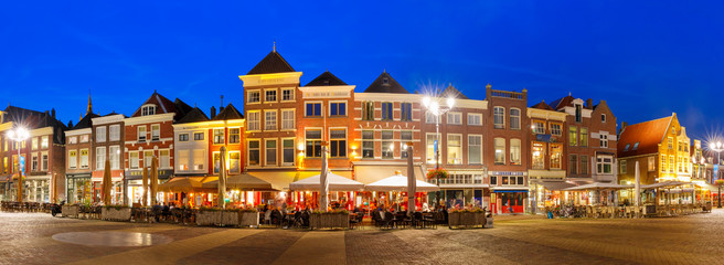 Panorama Markt square with typical Dutch houses in the center of the old city at night, Delft,...