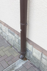 Brickwork and downspout