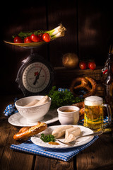 Bavarian sausage with pretzel, sweet mustard and beer