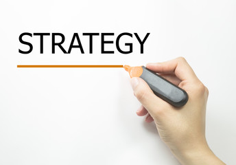 Hand writing Strategy with marker on transparent wipe board.