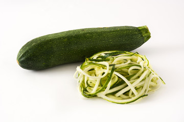 Delicious zucchini noodles isolated on white background

