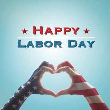 Happy labor day text message with America flag pattern on people hands in heart shaped on vintage blue sky background: United states of america- USA labor day, constitution, citizenship concept.
