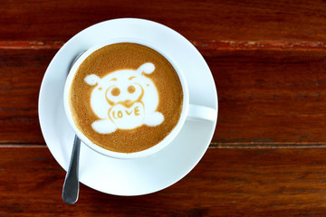 Coffee cup with dog picture on top
