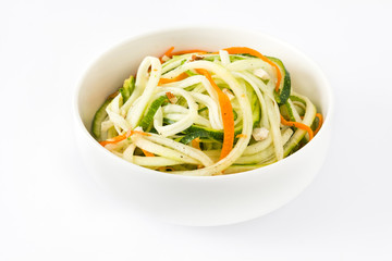 Carrot and zucchini noodles in bowl isolated

