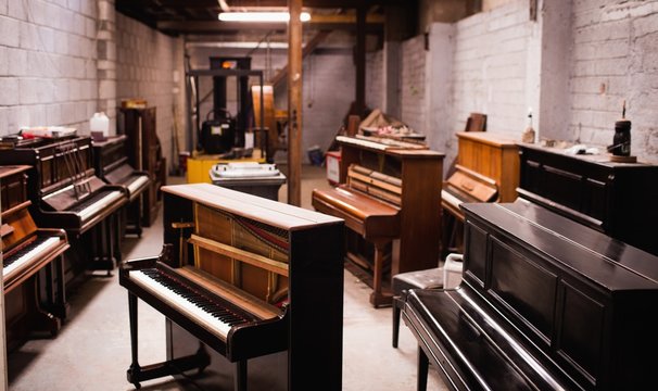 Varieties of pianos in workshop