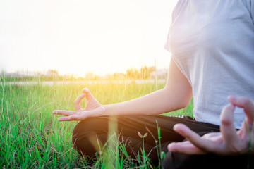 Yoga woman in the lotus posture Exercises Outdoor