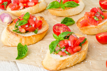 Bruschetta with tomato, onion and fresh basil