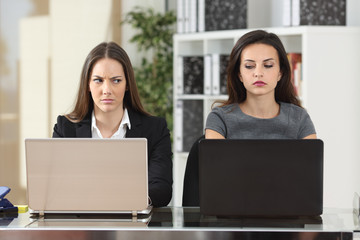 Angry businesswomen looking with hate