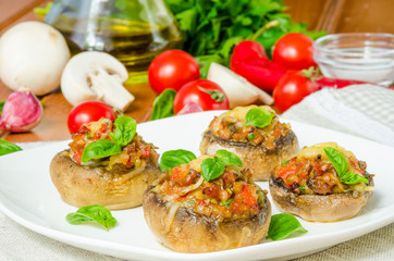 Mushroom caps stuffed with vegetables and cheese