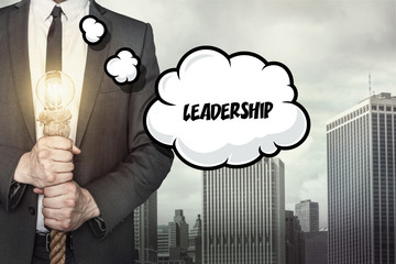 Leadership text on speech bubble with businessman