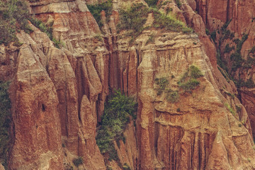 Spectacular view of a unique steep erosion sandstone cliff of the Red Ravine (Romanian: Rapa Rosie), a protected area near Sebes, Alba county, Romania.
