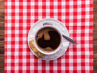 black coffee on checkered restaurant table