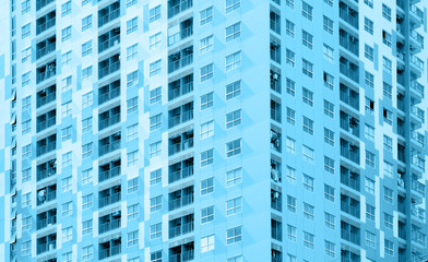 Apartment building / View of balconies of apartment building. Blue tone.