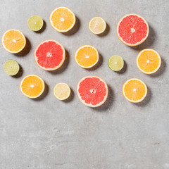 Sliced fruits on gray stone table