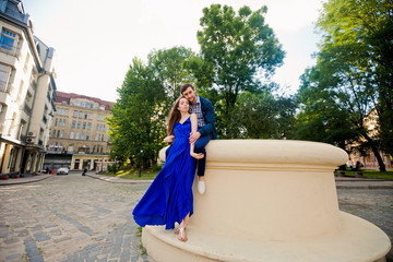 Fototapeta premium Attractive young girl is standing near her boyfriend