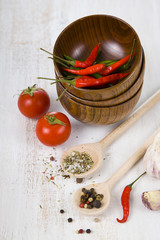 Vegetables and spices in wooden bowls