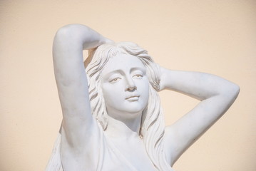 Detail of the garden sculpture of a young woman (not a work of art)
