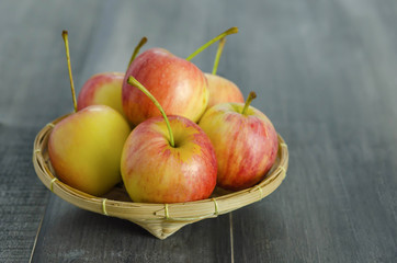 Red and yellow apple   on wooden background