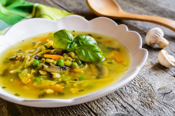 Mushroom soup with carrot, pea, kale, parsley, celery and onion
