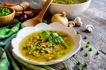 Mushroom soup with carrot, pea, kale, parsley, celery and onion