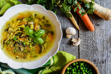 Mushroom soup with carrot, pea, kale, parsley, celery and onion